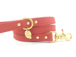Red vegan silicone leather dog lead with solid brass trigger snap, made in the UK.