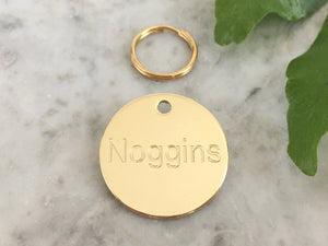 Luxury brass and silver cat and dog ID tags engraved with personalised text in the UK