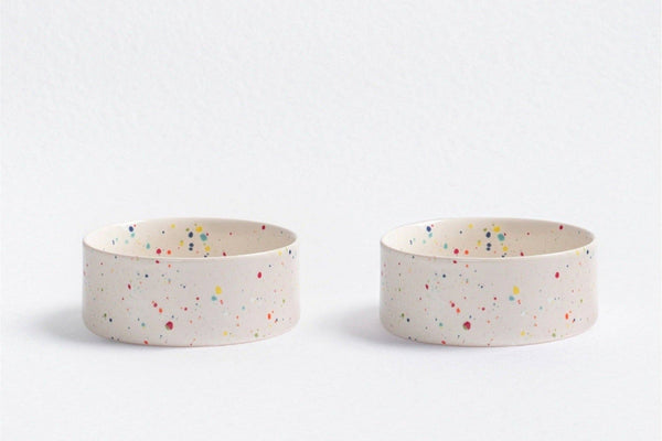 Handmade ceramic cat bowl white with splattered speckles.
