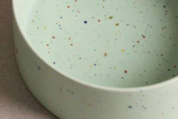 Handmade ceramic dog and puppy bowl green speckles.
