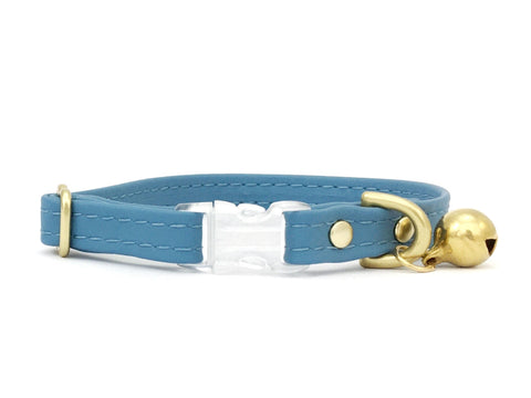 Light blue cat collar in vegan silicone leather and luxury brass bell. Made in the UK.