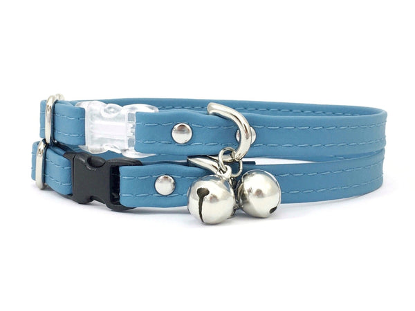 Light blue cat collar with breakaway buckle and silver bell in vegan silicone leather.