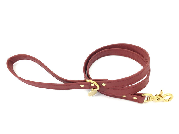 Burgundy dog lead in vegan silicone leather and luxury brass.