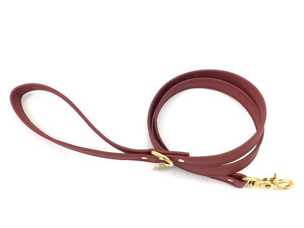 Burgundy silicone dog lead in vegan  leather and brass, made in the UK.