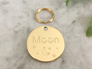 Cat ID tag with unique moon and star design, made from luxury brass. Engraved in the UK.