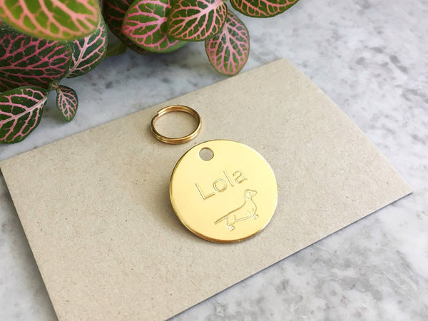 Miniature Dachshund dog ID tag in luxury solid brass with personalised engraving. Engraved in the UK.