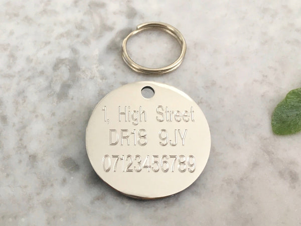 Silver dog ID tag with unique moon and stars design in luxury solid stainless steel, engraved in the UK.