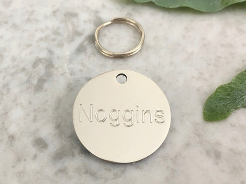 Dog ID tag in silver stainless steel, suitable for puppies and dogs, personalised and engraved in the UK.