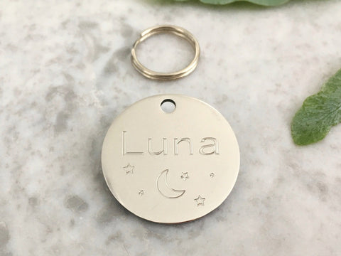 Dog ID tag with moon and stars design in silver stainless steel, engraved in the UK.