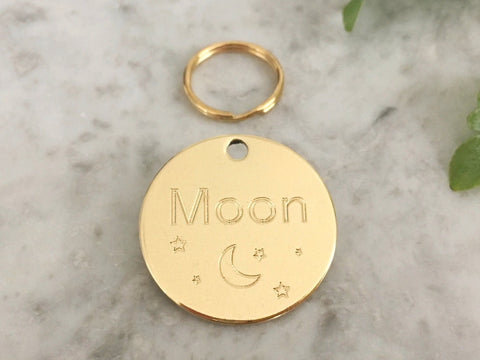 Dog ID tag with unique moon and stars design in luxury solid brass. Personalised and engraved in the UK.