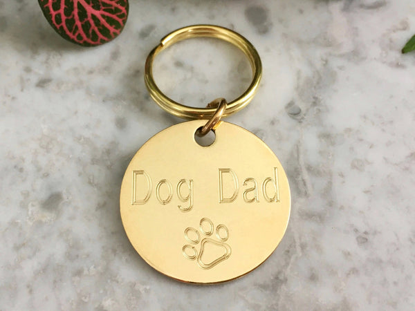 Dog dad gift keyring in luxury brass with personalised engraving in the UK.