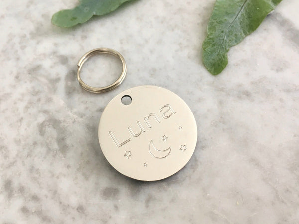 Moon and stars dog and puppy ID tag in silver stainless steel, engraved in the UK.