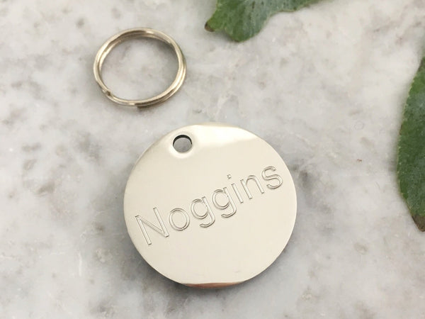 Luxury dog ID tag in mirror polished stainless steel, suitable for puppies and dogs, engraved in the UK.