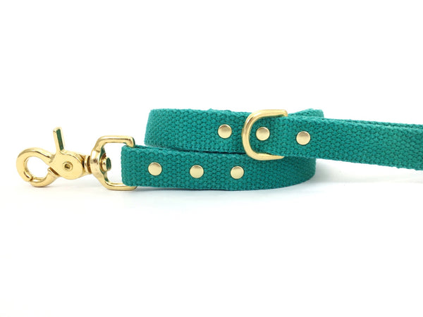 Emerald green dog and puppy lead in cotton webbing and luxury brass, made in the UK.