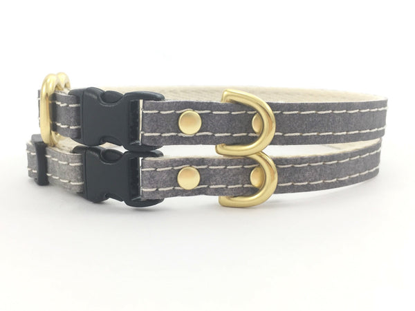 Grey vegan leather extra small dog and puppy collar with solid brass hardware and a quick release buckle, designed for small dogs.