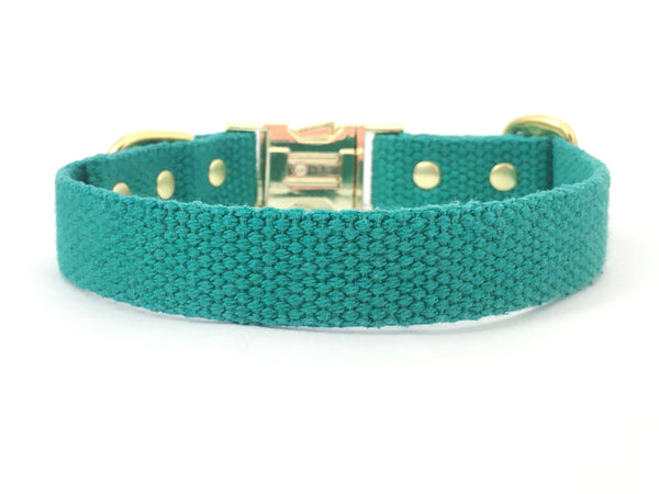 Green dog and puppy collar in soft and strong cotton webbing with luxury brass buckle and rivets.