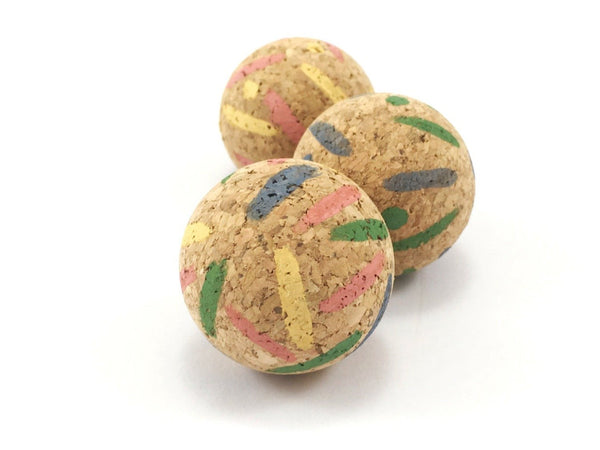 Eco friendly cat ball toys made from vegan and biodegradable cork bark with a colourful stripes and spots pattern
