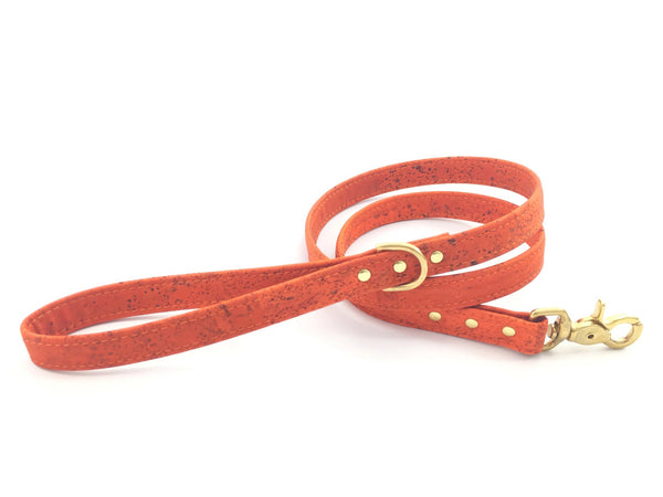 Orange dog lead in ethical vegan leather with gold brass hardware, made in the UK