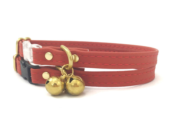 Red silicone cat collar in vegan silicone leather with luxury brass bell.