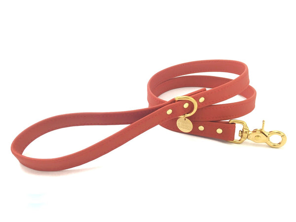 Red silicone dog and puppy lead in ethical vegan leather and luxury brass.