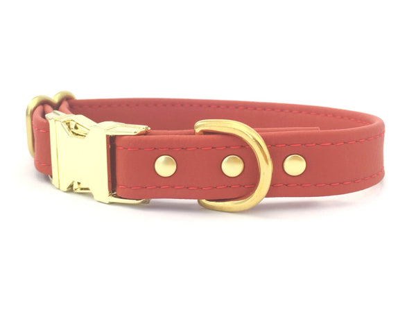 Red silicone dog collar in ethical vegan leather with brass quick release buckle, made in the UK.