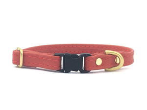 Red silicone miniature dog and puppy collar, suitable for tiny dogs and puppies including toy breeds. Made in vegan leather with luxury brass hardware.