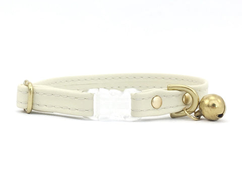 Silicone cat collar in ivory white vegan silicone leather with breakaway buckle and bell.