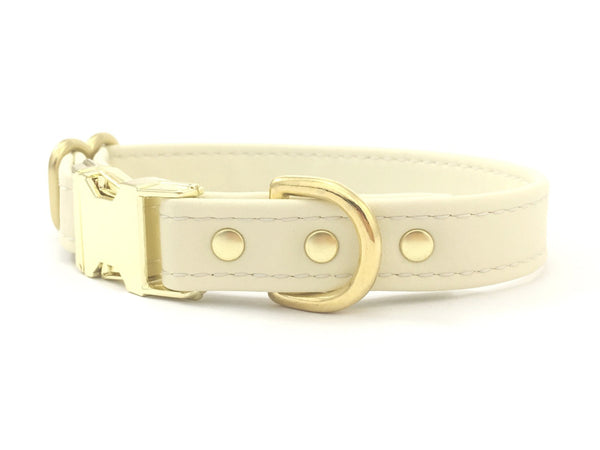 Silicone dog collar in white vegan silicone leather, waterproof and scratch proof, with brass buckle, made in the UK.