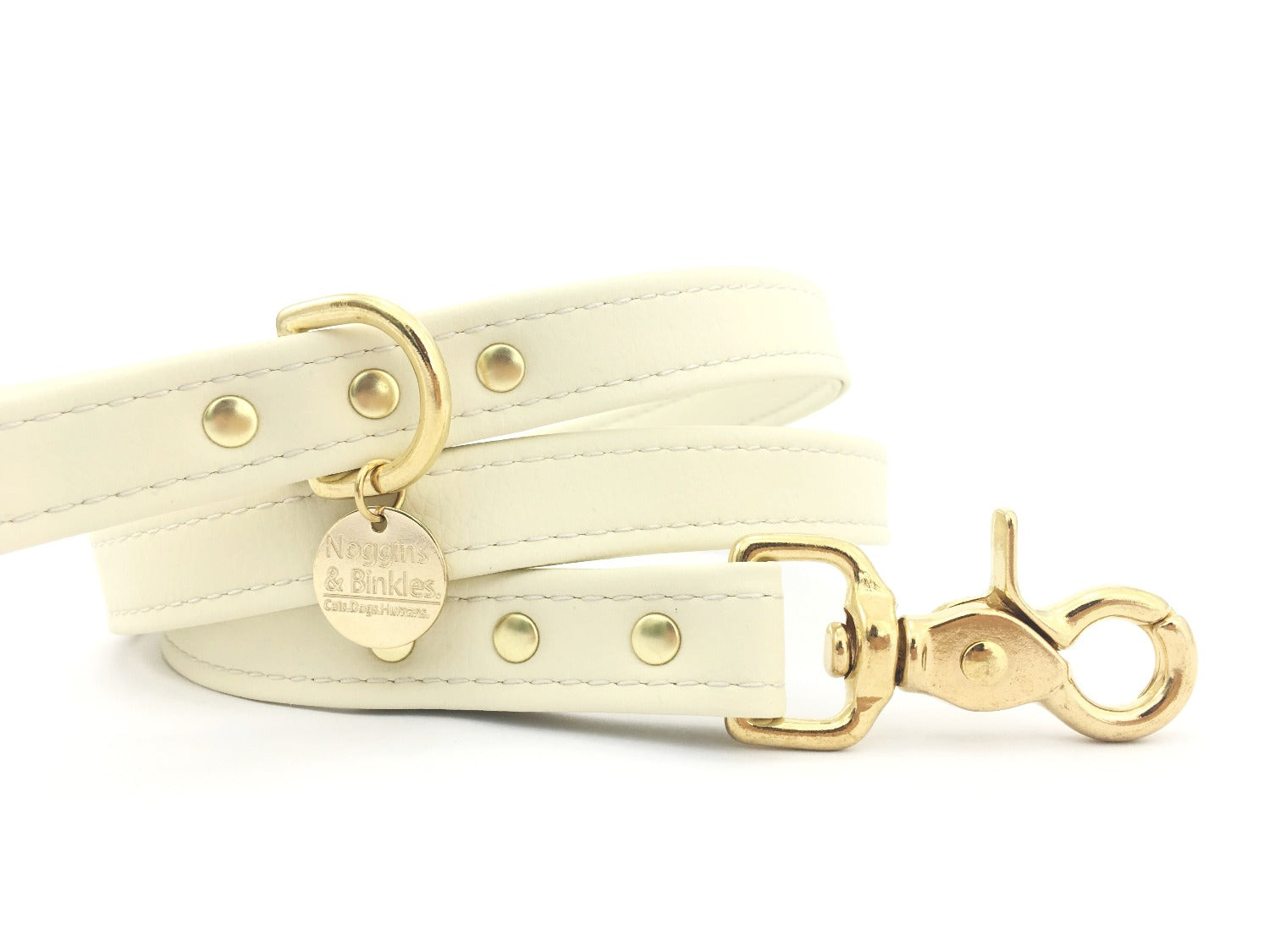 Silicone dog lead in ivory white vegan silicone leather with luxury brass hardware.