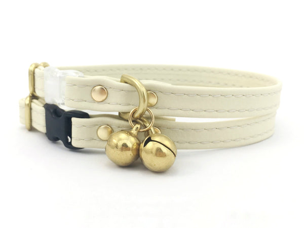 White vegan silicone leather breakaway cat collar with brass bell, scratch resistant and waterproof. 