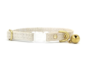 White vegan cork leather cat collar with breakaway buckle and luxury brass bell, made in the UK.